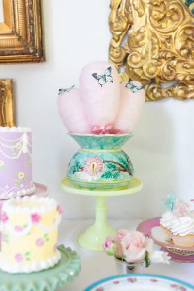 cakes and cotton candy on dessert table